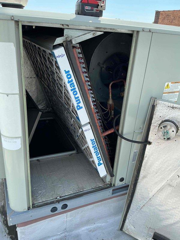 Completed spring maintenance clean and check on rooftop HVAC unit per Comfort Care Plan agreement. Accessed RTU using ladder, removed panels, and inspected evaporator coil and blower assembly. Replaced four 16x25x2 air filters, cleaned accessible components, and verified proper operation of all mechanical systems. Unit returned to normal service with all panels secured.