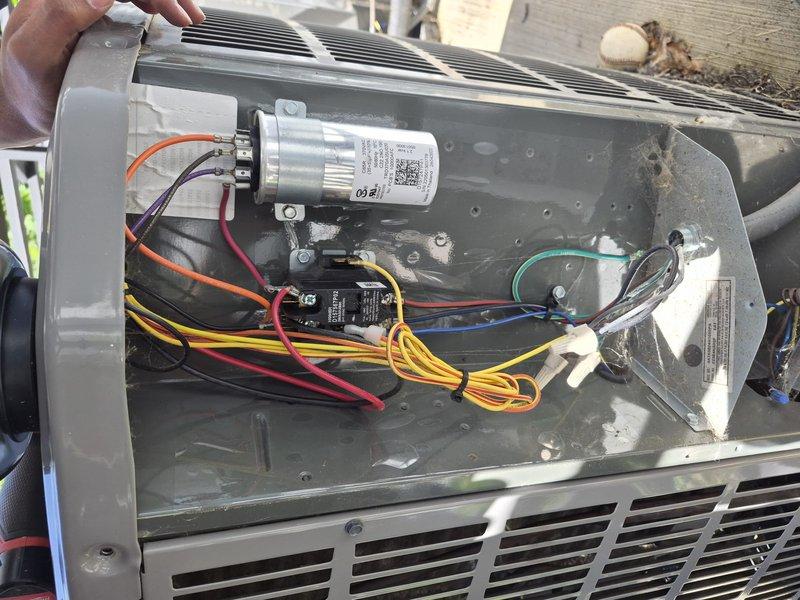 # HVAC Maintenance Summary

Completed comprehensive spring clean and check maintenance service on a two-system HVAC installation per Good Comfort Plan protocol. Performed thorough inspection of wall-mounted air handler and base unit, including electrical component testing of capacitor and relay switches, verification of all wire connections, and assessment of condensate drainage system. All systems operational and functioning within normal parameters.

# Detailed Service Description

Performed seasonal preventive maintenance on dual HVAC system installation located in mechanical utility room. Conducted complete visual inspection of wall-mounted gray cabinet air handler unit and corresponding base equipment with integrated ductwork system.

Accessed electrical compartment to inspect internal components including dual-run capacitor, relay switches, and associated wiring harness. Verified all electrical connections were secure with proper terminations on capacitor terminals and relay cont