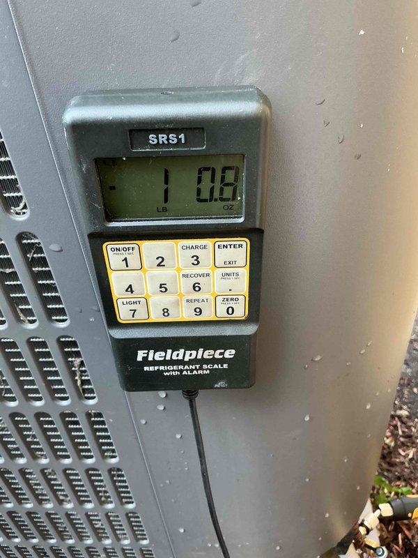 Responded to no cooling complaint on residential air conditioning system. Upon arrival, performed diagnostic testing of outdoor unit electrical components including capacitor voltage readings with multimeter. Evaluated refrigerant charge using digital scale, which indicated system was 10.8 pounds low on refrigerant. Identified leak in system, performed necessary repairs, and recharged unit to manufacturer specifications to restore proper cooling operation.