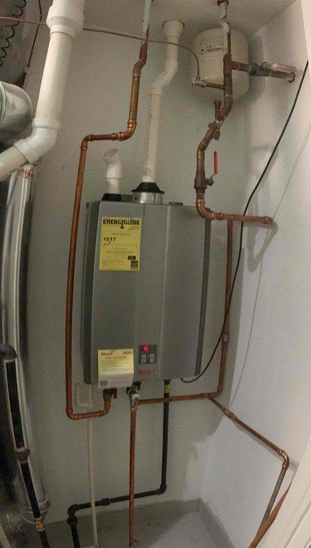 Responded to callback for tankless water heater displaying error code 12, same issue as previous day's service call. Upon arrival, inspected unit and discovered debris-clogged inlet filter screen causing flow restriction and triggering fault code. Removed and cleaned inlet filter assembly, cleared accumulated sediment from mesh screen, reinstalled filter, and reset system. Verified proper water flow through copper supply lines and confirmed unit operation with no error codes displayed. System restored to normal function.