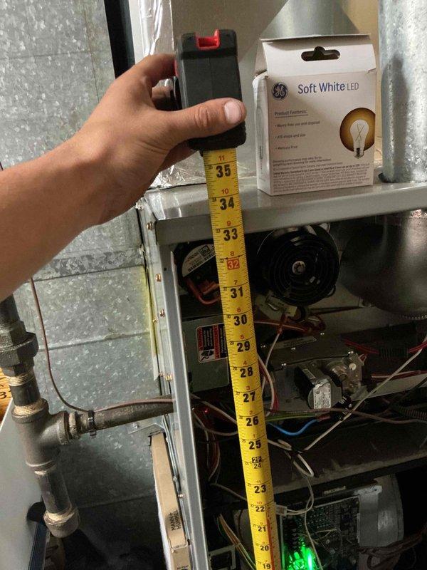 Responded to service call for commercial air conditioning unit with reported blower failure and frozen refrigerant line. Upon arrival, confirmed system was shut down due to frozen evaporator coil. Performed diagnostic testing of electrical components and measured amperage draw on blower motor, which registered 34.0 amps. Identified blower motor failure as root cause preventing proper airflow across evaporator coil, resulting in ice formation on refrigerant lines. Recommended blower motor replacement and system defrost before resuming operation to prevent compressor damage.