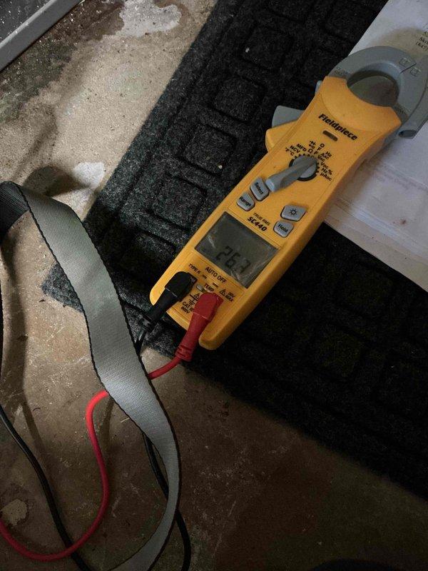 Responded to service call for commercial air conditioning unit with reported blower failure and frozen refrigerant line. Upon arrival, confirmed system was shut down due to frozen evaporator coil. Performed diagnostic testing of electrical components and measured amperage draw on blower motor, which registered 34.0 amps. Identified blower motor failure as root cause preventing proper airflow across evaporator coil, resulting in ice formation on refrigerant lines. Recommended blower motor replacement and system defrost before resuming operation to prevent compressor damage.