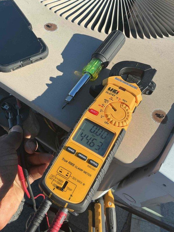 Performed comprehensive pre-season tune-up and inspection on rooftop-mounted air conditioning unit, serial number 0190023638. System had not been operated since previous cooling season. Conducted full electrical diagnostics using clamp meter, recording voltage at 240.8V and amperage at 27.5A, confirming proper power supply and compressor operation. Inspected condenser coil condition, refrigerant lines, and all mechanical components. All measurements within normal operating parameters; system tested and found operational with no immediate replacement necessary.