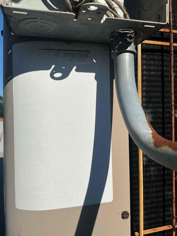 Performed comprehensive pre-season tune-up and inspection on rooftop-mounted air conditioning unit, serial number 0190023638. System had not been operated since previous cooling season. Conducted full electrical diagnostics using clamp meter, recording voltage at 240.8V and amperage at 27.5A, confirming proper power supply and compressor operation. Inspected condenser coil condition, refrigerant lines, and all mechanical components. All measurements within normal operating parameters; system tested and found operational with no immediate replacement necessary.