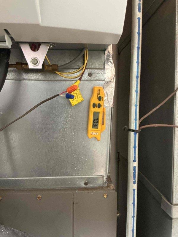 Responded to no cooling complaint with blower motor fan not operating. Upon arrival, verified thermostat settings and checked breakers. Performed diagnostic evaluation of HVAC system electrical components and measured supply air temperature reading of 32.0°F at plenum. Inspected contactor assembly, terminal connections, and control wiring. Documented equipment information and captured diagnostic measurements of refrigerant lines and electrical connections for service records.