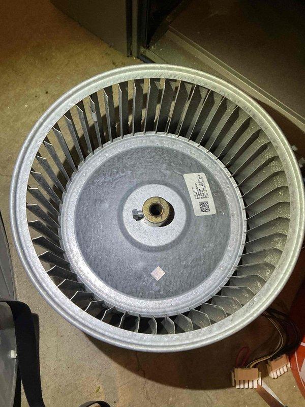 Performed blower wheel cleaning service on HVAC system. Removed squirrel cage fan assembly from unit, which showed significant dust and debris accumulation on blades and internal surfaces. Thoroughly cleaned all blower wheel components, reinstalled assembly, and verified proper operation.