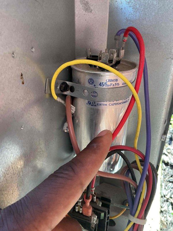 Completed comprehensive tune-up and preventive maintenance on two Goodman air conditioning systems. Performed detailed inspection of outdoor condenser unit including electrical components, capacitor testing (LDB65R 45/5μF dual run capacitor verified within specification), contactor operation, and refrigerant system evaluation. Both systems operational and running efficiently upon completion.