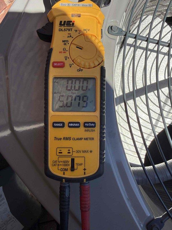 Responded to service call for excessive noise complaint on air conditioning unit. Upon arrival, performed diagnostic testing of condenser fan motor using digital clamp meter to measure electrical draw and verify proper amperage readings. Measurements indicated motor operating within normal parameters at approximately 4 amps and 50 volts. Inspected condenser fan assembly, fan blades, and mounting hardware for potential sources of excessive noise. Documented equipment readings and visual inspection with photographs for warranty records.