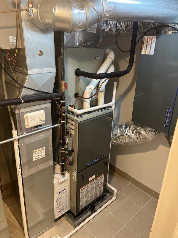 Performed comprehensive assessment of existing first-floor furnace and air conditioning system to determine repair versus replacement viability. Upon inspection of attic-mounted equipment and basement HVAC installation, provided detailed estimate for complete furnace and AC replacement system. Documented current system configuration including ductwork connections, PVC condensate drainage, refrigerant lines, and electrical components to facilitate accurate equipment sizing and replacement specifications.
