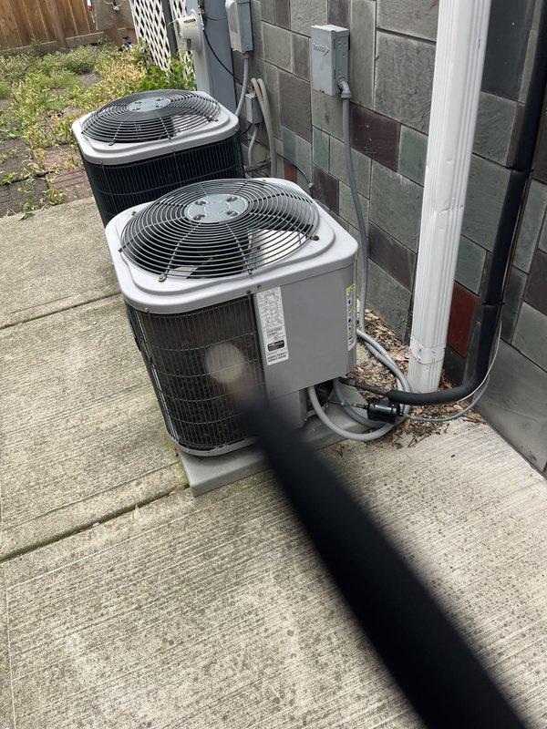 Responded to service call for AC not cooling evenly with safety pan full of water. Upon arrival, assessed outdoor installation with three condenser units positioned on concrete pad. Documented existing HVAC equipment configuration, electrical connections, and associated plumbing infrastructure. Collected equipment information including manufacturer specifications and unit details for new customer account. Provided estimate for complete system replacement based on current equipment condition and performance issues identified during inspection.