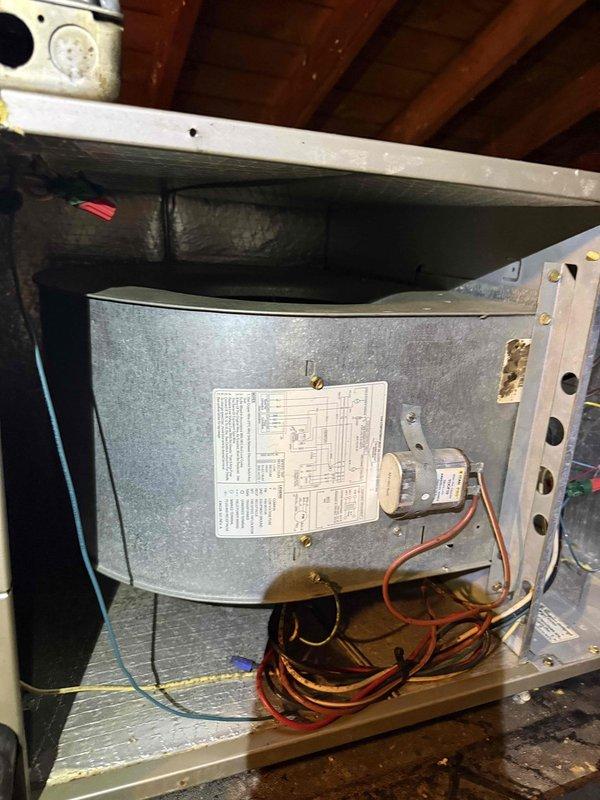 Responded to service call for inadequate cooling and unusual operating noise from attic-mounted air handler. Upon inspection, found blower wheel heavily contaminated with dust and debris buildup, causing restricted airflow and abnormal sound during operation. Cleaned blower assembly, removed accumulated debris from cabinet interior, and verified proper electrical connections and control wiring. System tested and confirmed restored airflow and normal operation with no abnormal noise. Discussed preventive maintenance options and documented equipment information for service records.