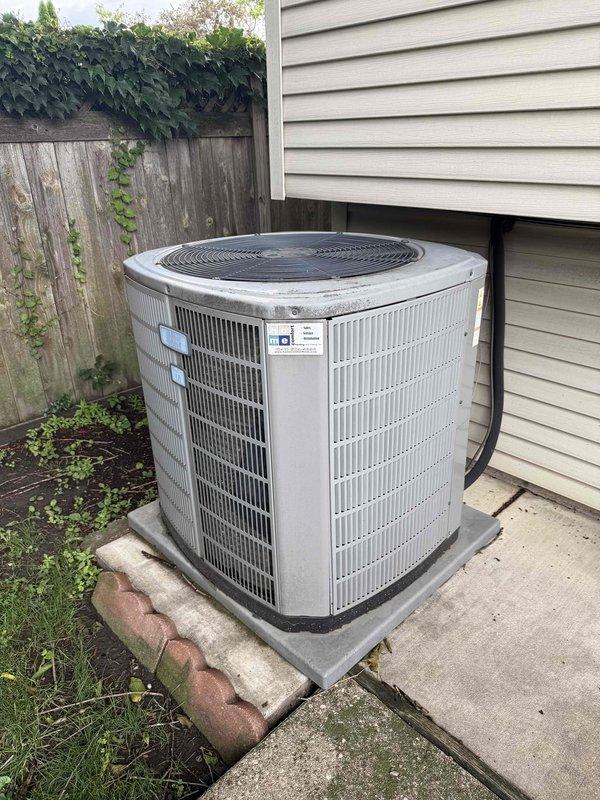Completed comprehensive clean and check maintenance service on residential single-zone air conditioning system as part of comfort plan transfer to new homeowner. Performed thorough inspection of outdoor condenser unit including blower motor assembly, verified proper operation of all components, and documented equipment condition with photographic records showing normal operational wear and adequate system performance.