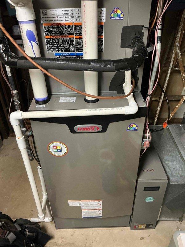 Responded to warranty callback for gas leak on recently installed Lennox furnace system. Located active leak at gas line elbow connection on interior furnace gas train near main supply line. Furnace and gas supply had been shut off by customer prior to arrival. Inspected gas piping connections and identified leak point at elbow joint. Repaired connection under warranty coverage. Performed leak test to verify repair integrity and system safety. Restored gas supply and returned furnace to normal operation.