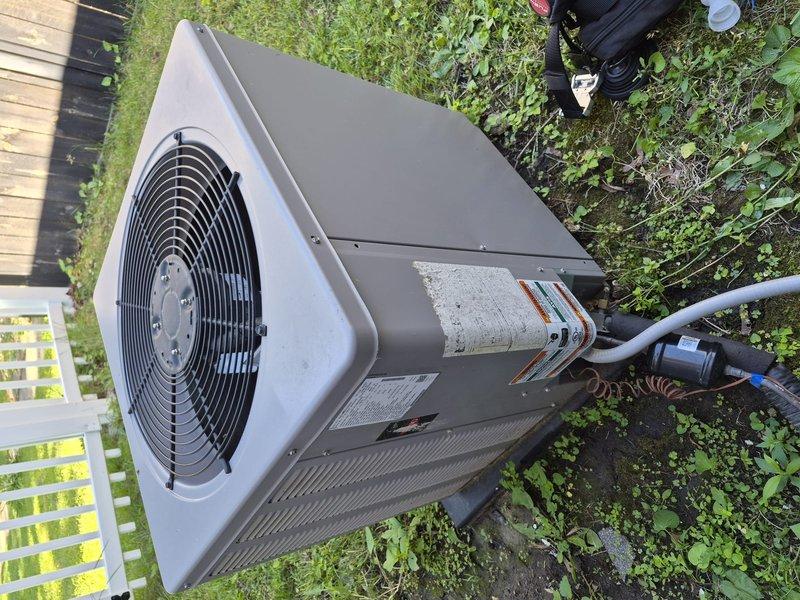 Completed preventive maintenance clean and check on residential air conditioning system per comfort plan agreement. Performed comprehensive inspection of outdoor condensing unit, verified electrical readings with digital multimeter showing proper voltage and amperage within manufacturer specifications, and confirmed unit operational status with all components functioning normally.