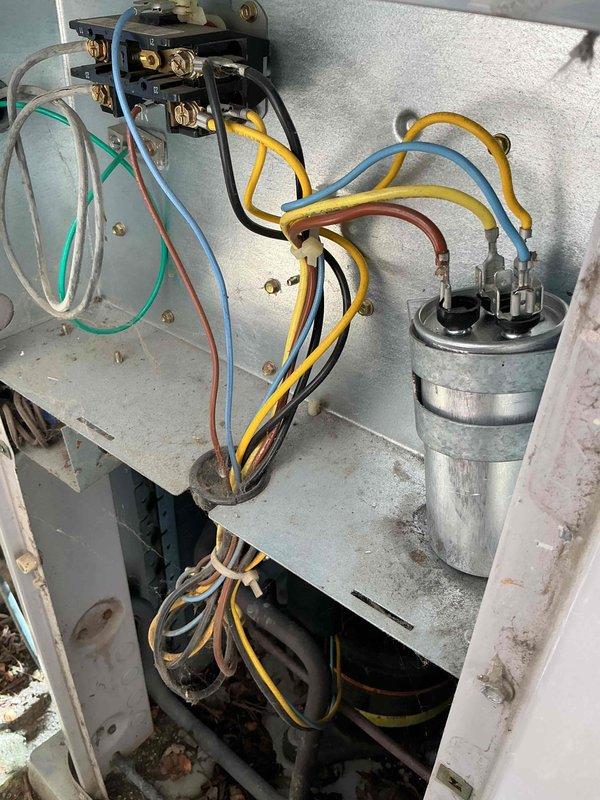 Completed spring preventative maintenance on air conditioning system per comfort plan agreement. Inspected and photographed electrical components including contactor and capacitor, verified proper wire connections, and replaced 20x25x4 air filters in HVAC system. All components found operating within normal parameters with system ready for cooling season.