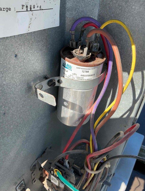 Responded to commercial property for rooftop unit evaluation. Upon inspection, replaced failed dual-run capacitor rated at 440/370VAC in RTU electrical compartment. Verified proper wire connections and system operation following capacitor replacement. Unit restored to normal operating condition.