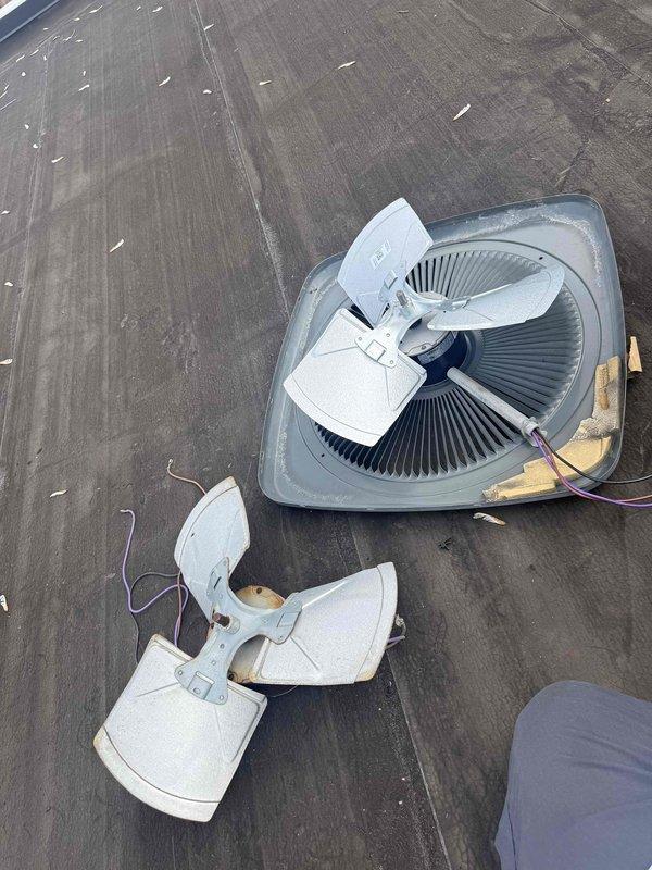 Replaced failed condenser fan motor and blade assembly on rooftop air conditioning unit. Removed old weathered fan components, installed new motor and blade, and restored proper operation to the condenser unit.