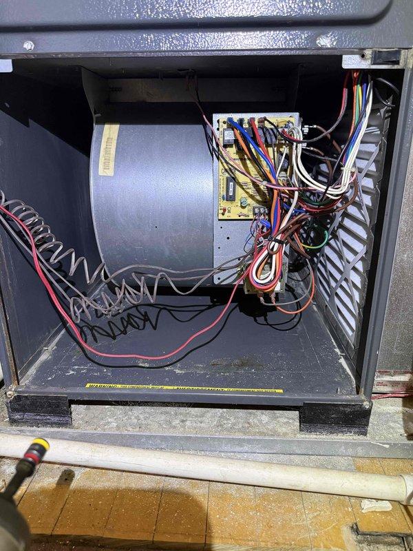 Performed comprehensive clean and check maintenance on second floor Goodman furnace and air conditioning system as part of Silver Comfort Plan service. Inspected blower motor assembly, control board, and electrical connections within furnace compartment, confirming all wiring harnesses and components operating within normal parameters. Documented system condition with interior and exterior photos showing proper installation of furnace unit, PVC condensate piping, and ductwork configuration.