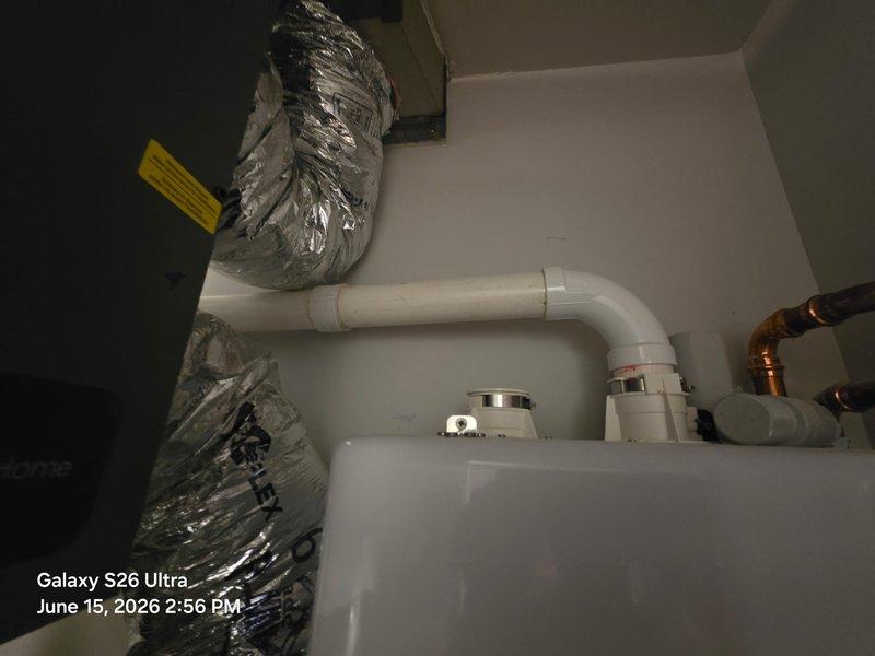 Responded to callback for leaking 2" PVC coupling on tankless water heater condensate drain line. Removed defective coupling section and installed new PVC coupling with proper pitch to ensure drainage. Added additional pipe support to prevent future stress on joints and verified no leaks upon completion.