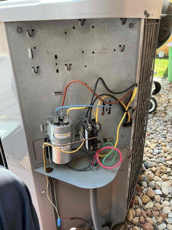 Completed annual tune-up maintenance on American Standard Gold Series air conditioning system. Performed comprehensive inspection of electrical components including capacitor, contactor, control boards, and all wire connections; verified proper operation of all system controls and safety devices. Documented system condition with interior component photography showing clean electrical compartment and properly functioning equipment.