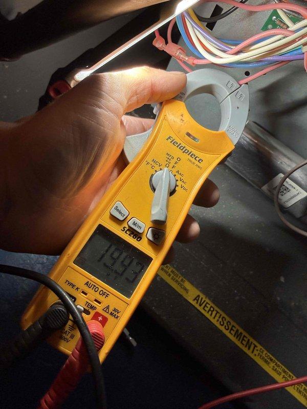 Completed comprehensive clean and check maintenance service on dual Goodman system including both air conditioning condenser unit and furnace for new customer enrollment. Performed electrical diagnostics with clamp meter showing 243V reading, inspected all wiring connections, documented complete equipment information and specifications for both units, and verified proper system operation. Both systems found in good working condition with no immediate repairs needed.