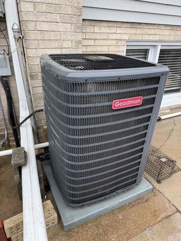 Completed comprehensive clean and check maintenance service on dual Goodman system including both air conditioning condenser unit and furnace for new customer enrollment. Performed electrical diagnostics with clamp meter showing 243V reading, inspected all wiring connections, documented complete equipment information and specifications for both units, and verified proper system operation. Both systems found in good working condition with no immediate repairs needed.