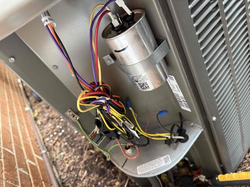 Completed spring clean and check maintenance on air conditioning system per comfort plan protocol. Performed thorough inspection of blower assembly and squirrel cage fan, noting dust accumulation on blades which was cleaned during service. Verified electrical components including capacitor connections and wiring harness, confirmed all terminals secure and system operational.