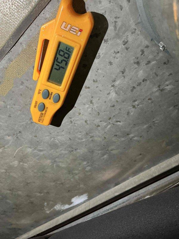 Completed Comfort Plan clean and check maintenance on Bryant air conditioning system. Performed comprehensive inspection of outdoor condensing unit, verified proper operation of all components, and checked refrigerant lines and electrical connections. System operating within normal parameters with temperature readings confirming adequate cooling performance at 45.8°F. Unit maintained in good condition with clear access and proper drainage on concrete pad.