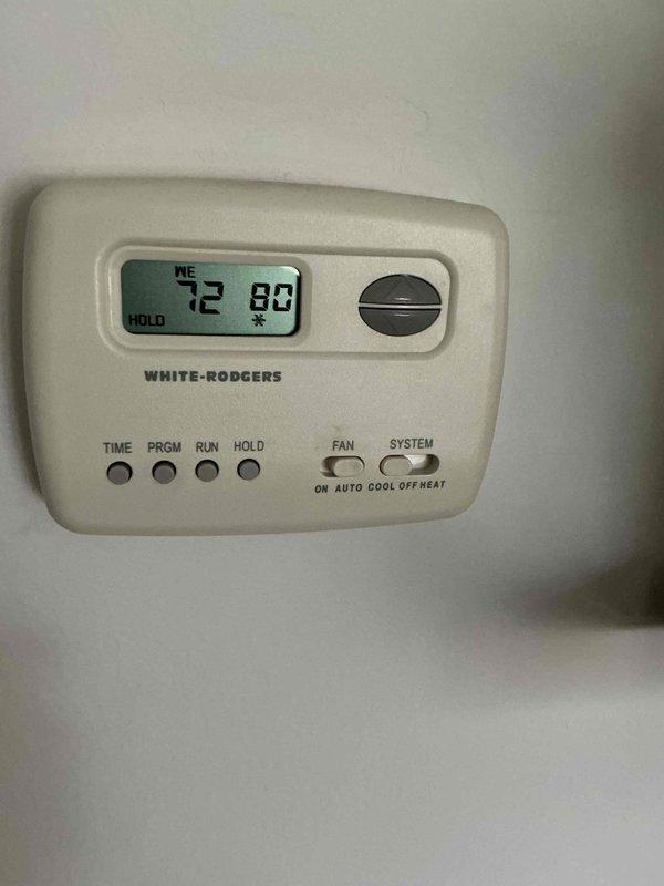 Completed comprehensive tune-up and maintenance on residential HVAC system including furnace and air conditioning components. Inspected White-Rodgers programmable thermostat for proper operation, verified temperature settings and control functions, and confirmed system cycling correctly between heating and cooling modes. Performed standard preventive maintenance procedures on furnace unit, inspected humidifier operation, checked all ductwork connections, and documented equipment condition with photographs for service records.