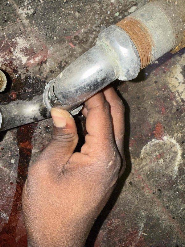 Responded to warranty callback for P-trap leak on recent installation. Upon inspection, identified leak at threaded connection point of metallic coupling component where trap assembly connects to drainage system. Disassembled affected section, inspected threaded fittings and coupling for proper seating and seal integrity. Found inadequate thread seal on brass-threaded connection. Cleaned threads, applied fresh pipe dope, and reassembled P-trap assembly with proper torque specifications. Tested system with water flow, verified no leakage at connection points. All components functioning properly with no active leaks detected at time of departure.