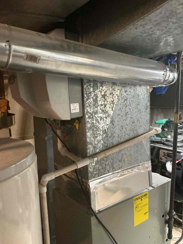 Completed complimentary tune-up and maintenance inspection on single-system HVAC unit located in basement utility area. Performed comprehensive system evaluation, documented all equipment specifications and model information for profile records, and captured photographic documentation of furnace, air handler, and ductwork configuration for service history files.