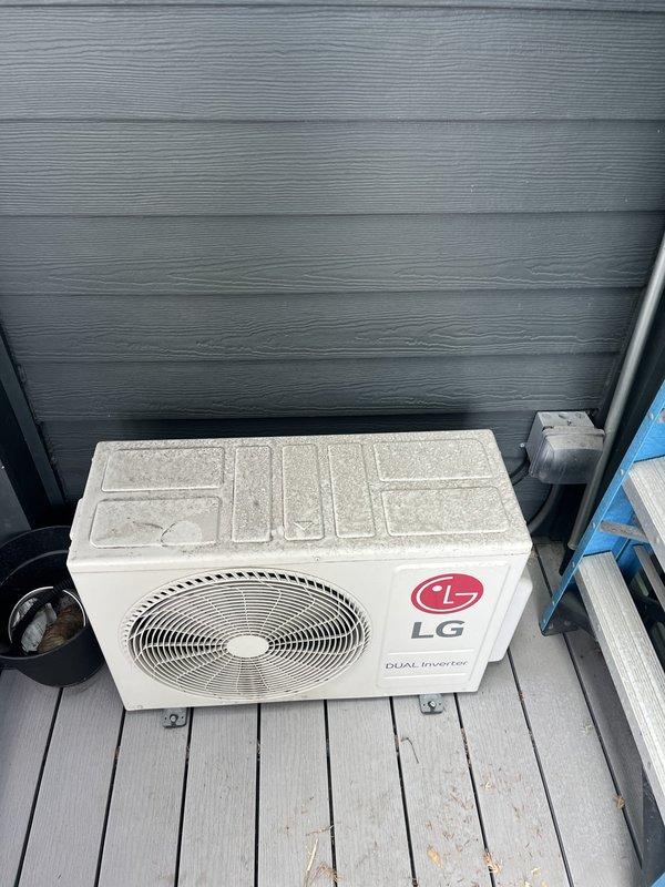 Conducted free estimate visit for mini-split system replacement at residential property. Assessed existing LG DUAL Inverter ductless system, including outdoor condensing unit mounted on rear deck and indoor wall-mounted air handler located in vaulted ceiling room with skylight. Documented current equipment condition, noting outdoor unit showing normal weathering and both components appearing operational. Provided customer with replacement options and pricing for new mini-split installation to address previous repair cost concerns.
