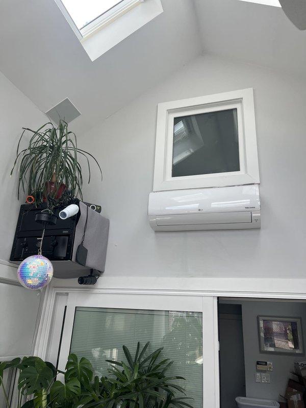 Conducted free estimate visit for mini-split system replacement at residential property. Assessed existing LG DUAL Inverter ductless system, including outdoor condensing unit mounted on rear deck and indoor wall-mounted air handler located in vaulted ceiling room with skylight. Documented current equipment condition, noting outdoor unit showing normal weathering and both components appearing operational. Provided customer with replacement options and pricing for new mini-split installation to address previous repair cost concerns.