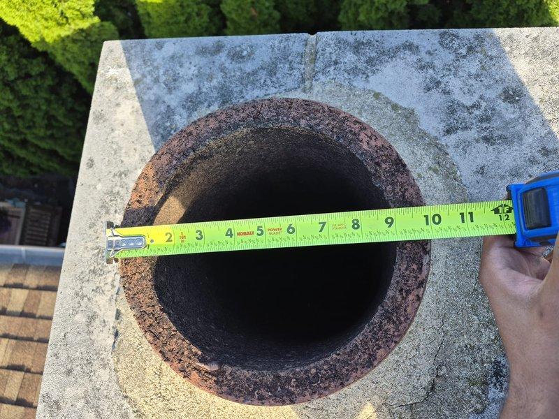 Replaced deteriorated rain cap on rooftop vent pipe. Upon inspection, found existing cap heavily corroded with significant rust buildup around the opening, compromising weatherproofing integrity. Removed old corroded rain cap, cleaned pipe opening to ensure proper seal, and installed new rain cap with appropriate diameter to prevent water intrusion and protect vent system from weather elements.