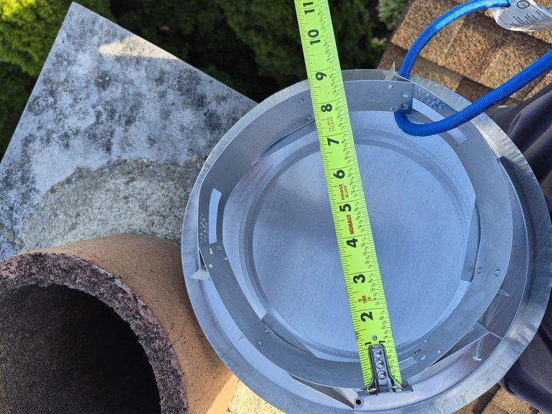 Replaced deteriorated rain cap on rooftop vent pipe. Upon inspection, found existing cap heavily corroded with significant rust buildup around the opening, compromising weatherproofing integrity. Removed old corroded rain cap, cleaned pipe opening to ensure proper seal, and installed new rain cap with appropriate diameter to prevent water intrusion and protect vent system from weather elements.