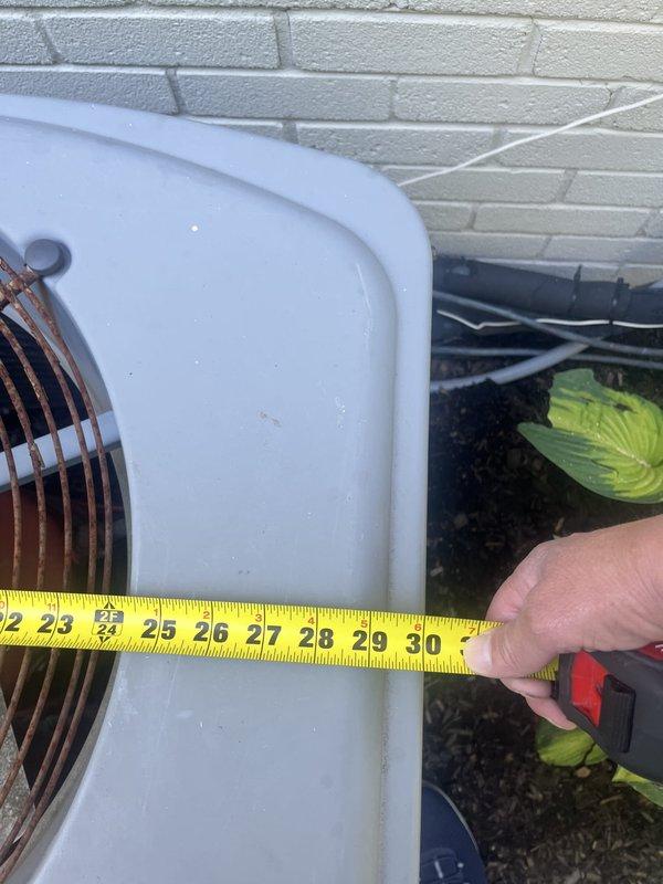 Completed HVAC estimate for air conditioning system replacement at residential property. Existing AC condenser unit measured and assessed; furnace is newer and will remain in service. Customer declined recommended comfort package options. Documentation photos captured of existing basement furnace installation and outdoor condenser unit positioning against exterior wall. Customer informed of credit card processing fee policy.