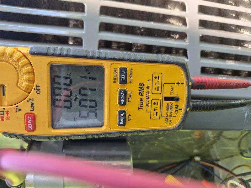Performed comprehensive clean and check maintenance on air conditioning system per Comfort Plan agreement. Conducted electrical diagnostics using digital multimeter to verify system voltage and amperage readings, confirming proper electrical supply at 28.8 volts to control circuits. Inspected indoor air handler unit with panel removed, examining blower motor assembly, control boards, wiring connections, and safety circuits for proper operation and signs of wear. All electrical connections tested and found secure, circuit boards functioning within normal parameters, and blower motor operating smoothly without unusual noise or vibration. System cleaned, tested, and returned to normal operation.