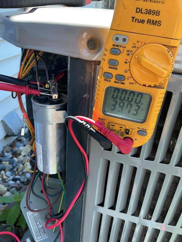 Completed comfort plan clean and check on single AC system. Performed electrical diagnostics using digital multimeter, measuring voltage and capacitance readings on system components. Inspected and tested capacitor and associated wiring connections. Replaced air filter with new unit. All system components operating within normal parameters upon completion of maintenance service.