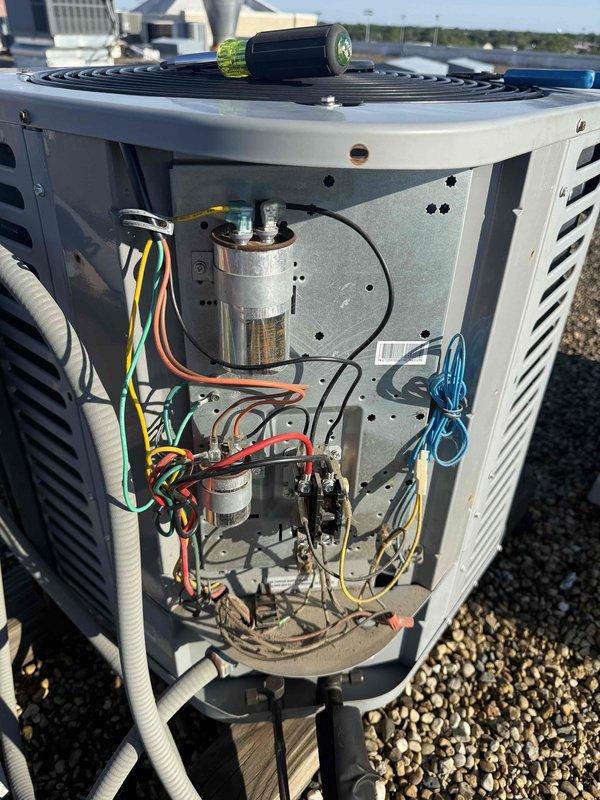 Replaced defective fan motor on rooftop Ameristar HVAC unit under manufacturer warranty. Accessed internal compartment, disconnected electrical connections and capacitor wiring, removed failed motor assembly, and installed new OEM replacement motor. Verified proper electrical connections, tested unit operation, and confirmed adequate airflow and system functionality upon completion.