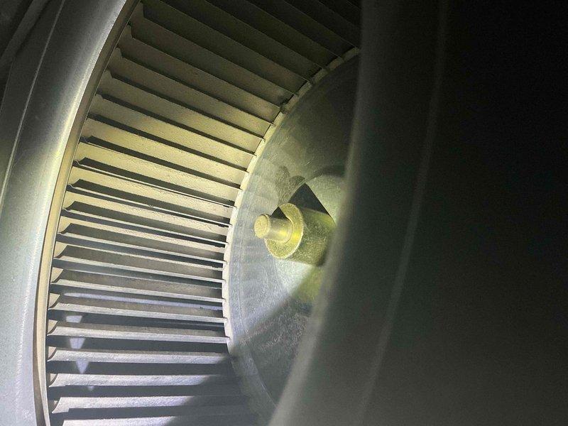 Completed annual air conditioning clean and check maintenance per service comfort plan. Inspected and photographed blower assembly showing clean wheel with proper blade condition and verified system operation with temperature readings of 35.5°F at evaporator coil, confirming adequate cooling performance and system functionality.