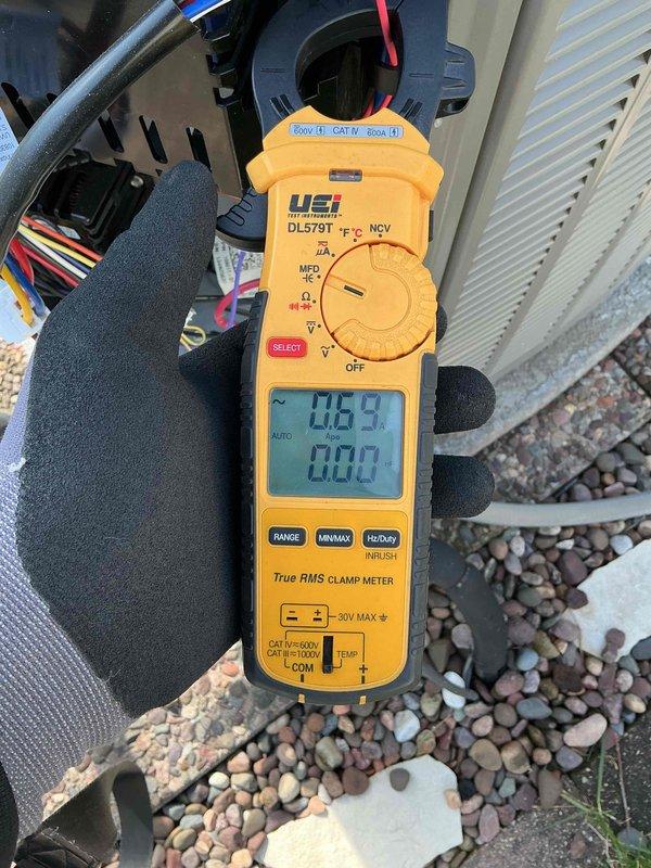 Completed annual air conditioning clean and check maintenance per service comfort plan on single system. Performed comprehensive inspection of outdoor condensing unit, verified proper electrical operation with amp draw readings showing 0.59 amps, cleaned condenser coil, checked refrigerant levels, and confirmed unit operational status. System operating within normal parameters with no deficiencies noted at time of service.