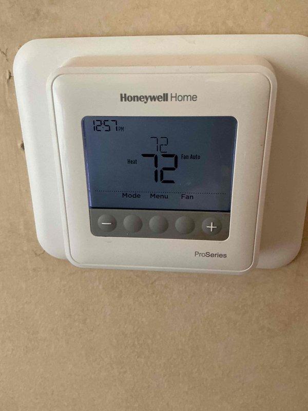 Responded to service call for non-responsive Honeywell Home ProSeries programmable thermostat with no heating functionality. Upon arrival, performed diagnostic evaluation of thermostat operation and verified system communication issues. Troubleshot thermostat controls, display functions, and temperature command responses. Restored proper thermostat operation, confirmed accurate temperature readings, and verified heating system engagement with proper fan auto operation.