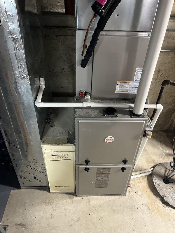Completed HVAC system replacement estimate for a medium-sized residential property requiring both heating and cooling equipment. Evaluated existing Payne furnace and air handler system located in basement utility space, along with outdoor condenser unit positioned on exterior concrete pad. Provided replacement options featuring Bryant and Amana brand equipment suitable for 1500-3000 square foot home with natural gas or propane fuel source, including integration with existing Space-Gard air filtration system and ductwork infrastructure.