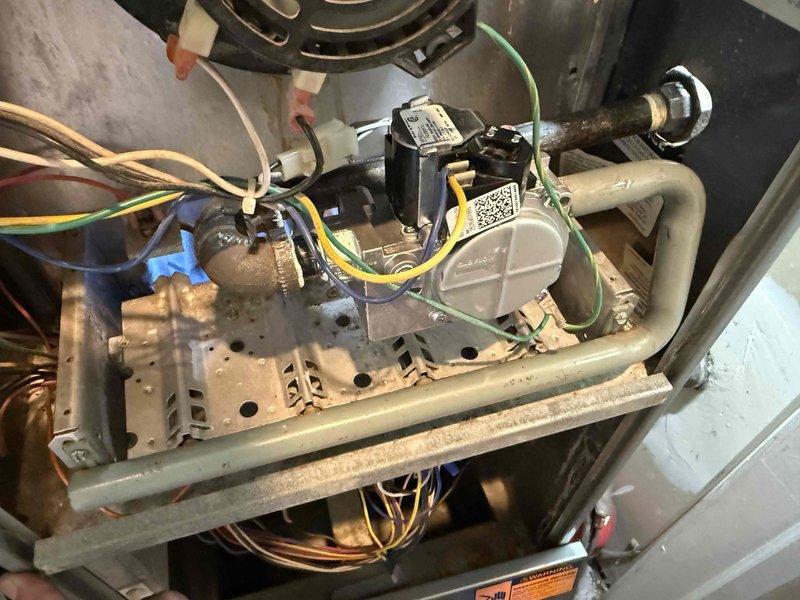 Replaced defective gas valve on residential gas furnace. Removed old valve assembly, installed new gas valve, and reconnected gas supply line. Verified proper burner ignition sequence and confirmed all four burners were operating with proper blue flame characteristics. Tested system operation through complete heating cycle to ensure reliable performance and safe combustion. All connections leak-tested and system restored to normal operation.