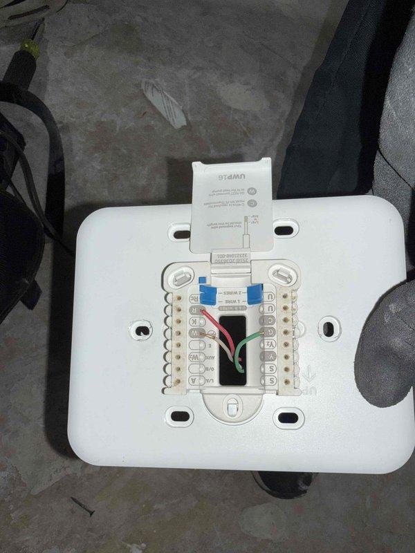 Installed new thermostat wire run from heat pump air handler to relocated wall-mounted thermostat position at 60 inches above finished floor height. Routed low-voltage wiring through unfinished framing to new thermostat location as specified by general contractor, terminated connections at both heat pump unit and thermostat, and verified proper wire identification at all terminal points.