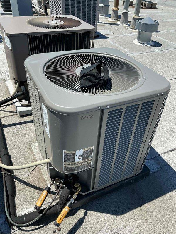 Responded to no cooling callback following previous service visit that included condenser coil cleaning, EZ Seal application, and refrigerant charge. Performed electrical diagnostics on rooftop unit using multimeter to test capacitor and circuit connections. Troubleshot system failure and addressed issues preventing proper operation after initial recall service work.