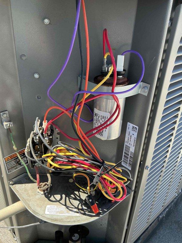 Responded to no cooling callback following previous service visit that included condenser coil cleaning, EZ Seal application, and refrigerant charge. Performed electrical diagnostics on rooftop unit using multimeter to test capacitor and circuit connections. Troubleshot system failure and addressed issues preventing proper operation after initial recall service work.