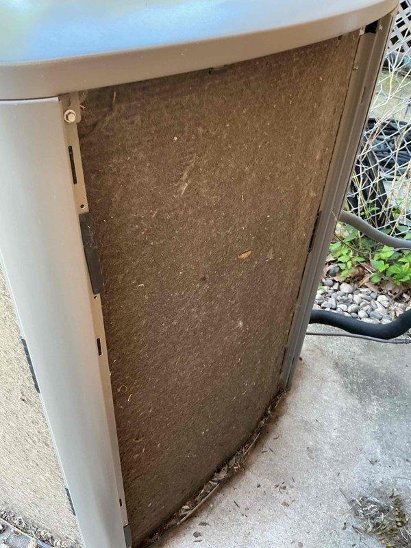 Completed preventive maintenance clean and check on residential air conditioning system per comfort plan agreement. Accessed indoor air handler through exterior panel, inspected evaporator coil and internal components. Serviced outdoor condenser unit which exhibited significant mineral deposits and environmental buildup on fin coil surfaces, performed thorough coil cleaning to restore heat transfer efficiency and system performance.