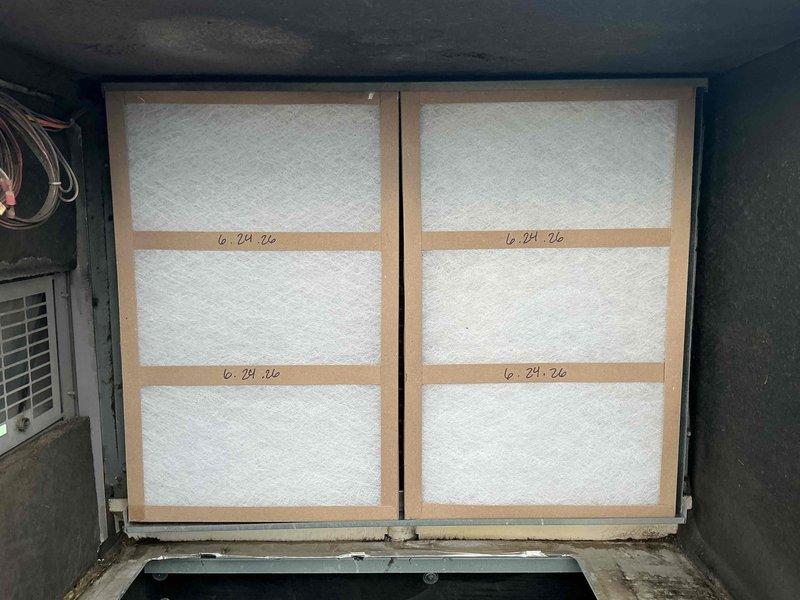 Performed summer filter change as part of Comfort Plan maintenance on single HVAC system. Replaced two 16x20x1 filters and two 16x25x2 filters in return air compartment, documented installation with date markings on filter frames, and verified proper fit and seating of all filters in housing.