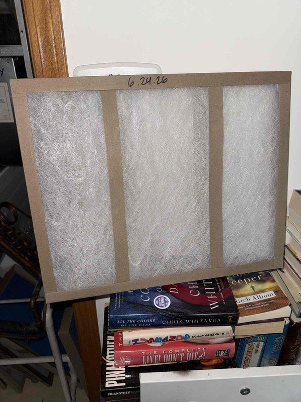 Performed summer filter change as part of Comfort Plan maintenance on single HVAC system. Replaced two 16x20x1 filters and two 16x25x2 filters in return air compartment, documented installation with date markings on filter frames, and verified proper fit and seating of all filters in housing.